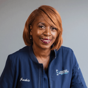 Senior Orthodontic Assistant, Jackie, smiling in her blue Markovitz Orthodontics shirt