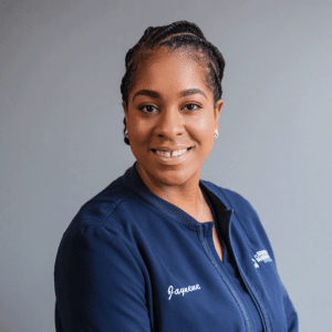 Experienced Orthodontic Assistant, Jaynene, smiling in her blue Markovitz Orthodontics shirt