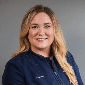Experienced Orthodontic Assistant, Lauren, smiling in her blue Markovitz Orthodontics shirt