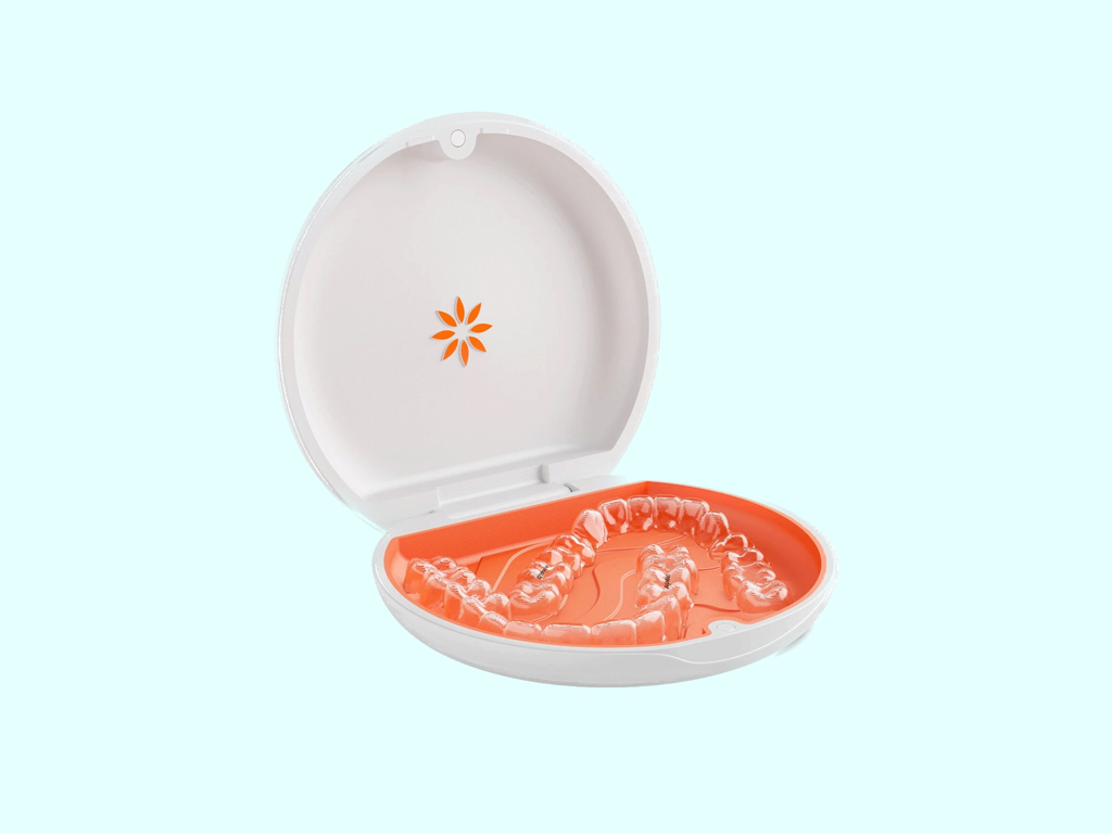 Sleek photo of a set of Vivera retainers in an orange and white case with the Invisalign logo
